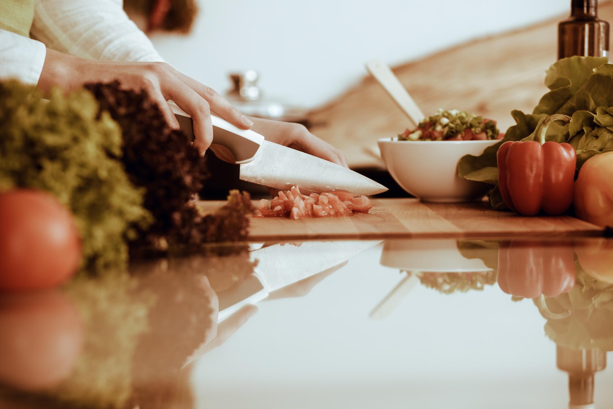 Hands preparing quick meal on rustic counter